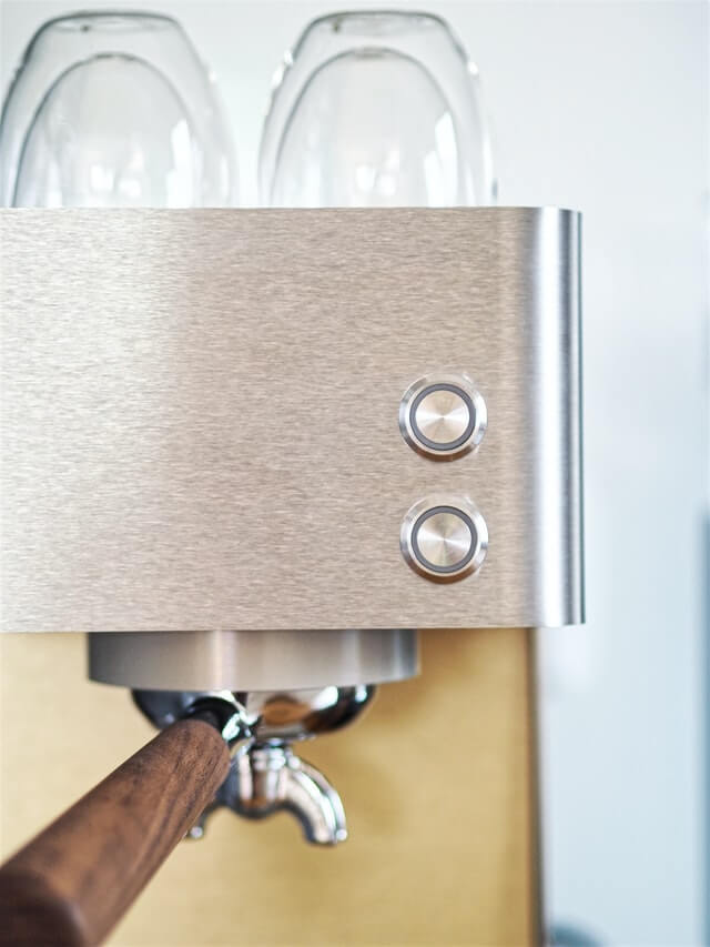 Brushed stainless steel surface on an espresso machine