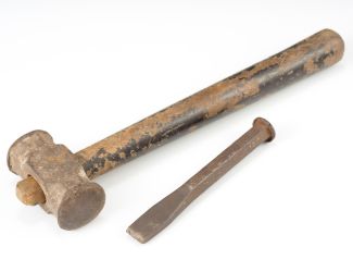 Classic tools for rebar work: a sturdy hammer and sharp chisel