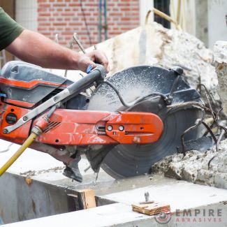 Heavy-duty concrete grinder at work, demonstrating preparation for construction and repair