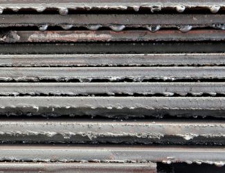 Stack of metal, showing metal burrs on the edge of the metal