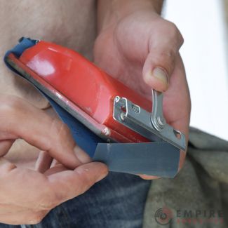 Sanding block tool with sandpaper being attached