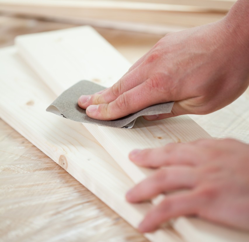 sand paper on wood - hand sanding