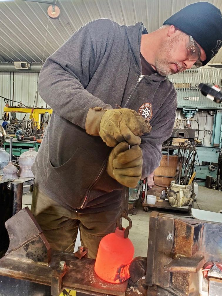 Tim Nelsen - metal artist forging metal for a sculpture 